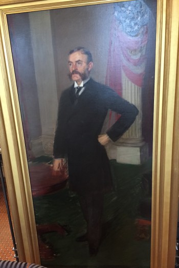 A portrait of Charles Schieren. Azrael marks his grave.