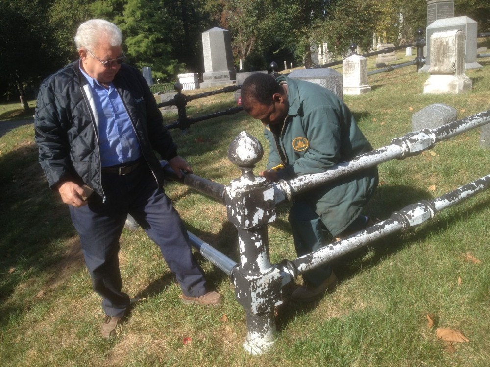 Green-Wood's metal workers, Dominck Lanzi and Vincent Joseph, working on the fence.