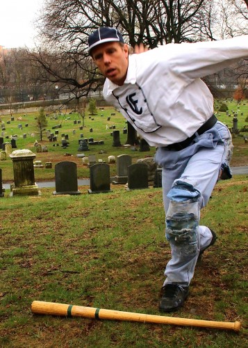 Eric Miklich demonstrates Jim Creighton's underhand pitching technique.