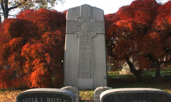 More Japanese cutleaf maples, to either side of a Celtic cross.