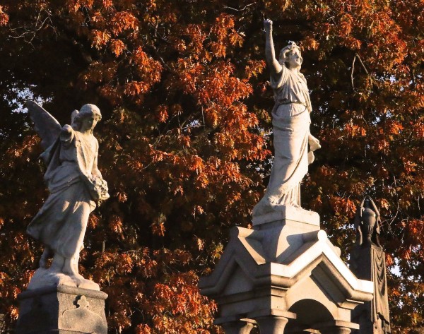 Female figures and oak leaves.