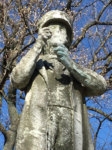 Detail of the Sea Captain. Note the green wash on the left hand. The marble figure, as designed, held the sextant (a navagational device) that was used by Captain John Correja to guide his ship across the seas.