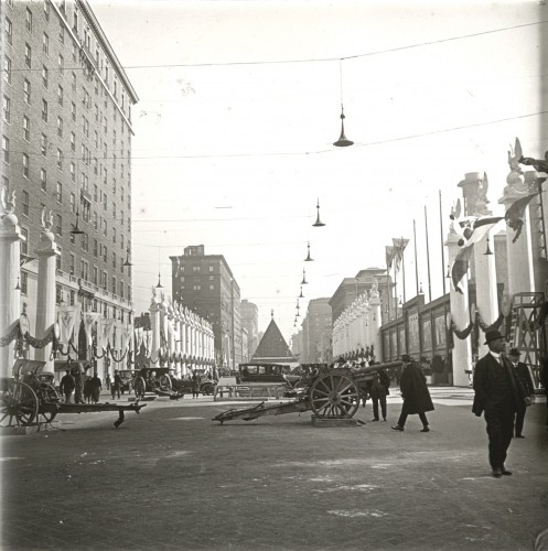 A longer view, up a New York City avenue, with the artillery shell pyramid in the distance.