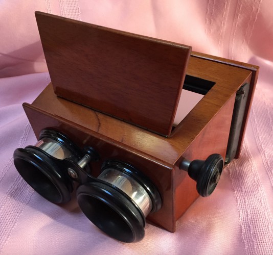 The stereoviewer for the glass slides. The slides are slid into the slot at right and the viewer looks through the lenses to get a 3D effect.