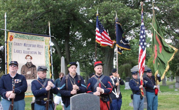 Civil War re-enactors and color guards framed the scene.