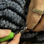 hands weaving with brooklyn ring