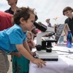 child with microscope