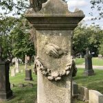 hands carved in monument