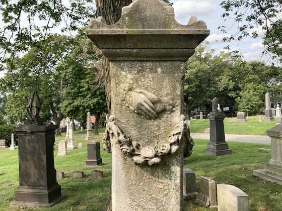 hands carved in monument