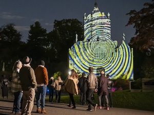 spectators watch historic chapel projection