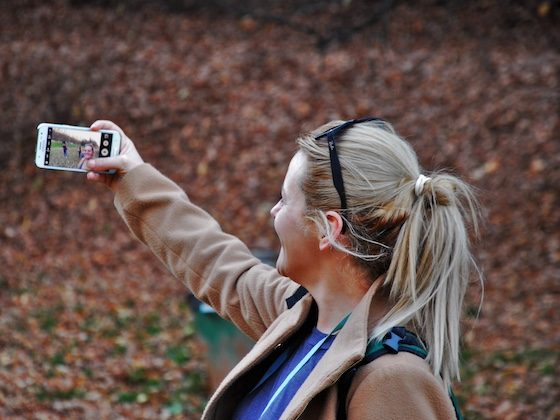 woman taking phone selfie